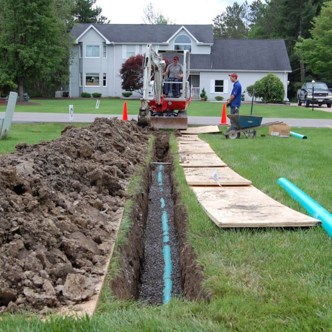 Workers fixing sewer line