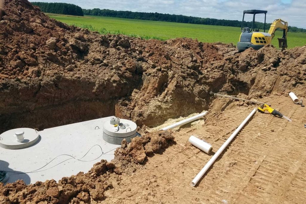 Excavator fixing sewer line