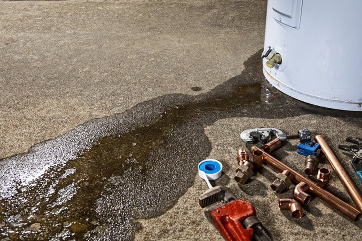 fluid coming out of heater, some tools for fixing it are placed on the side